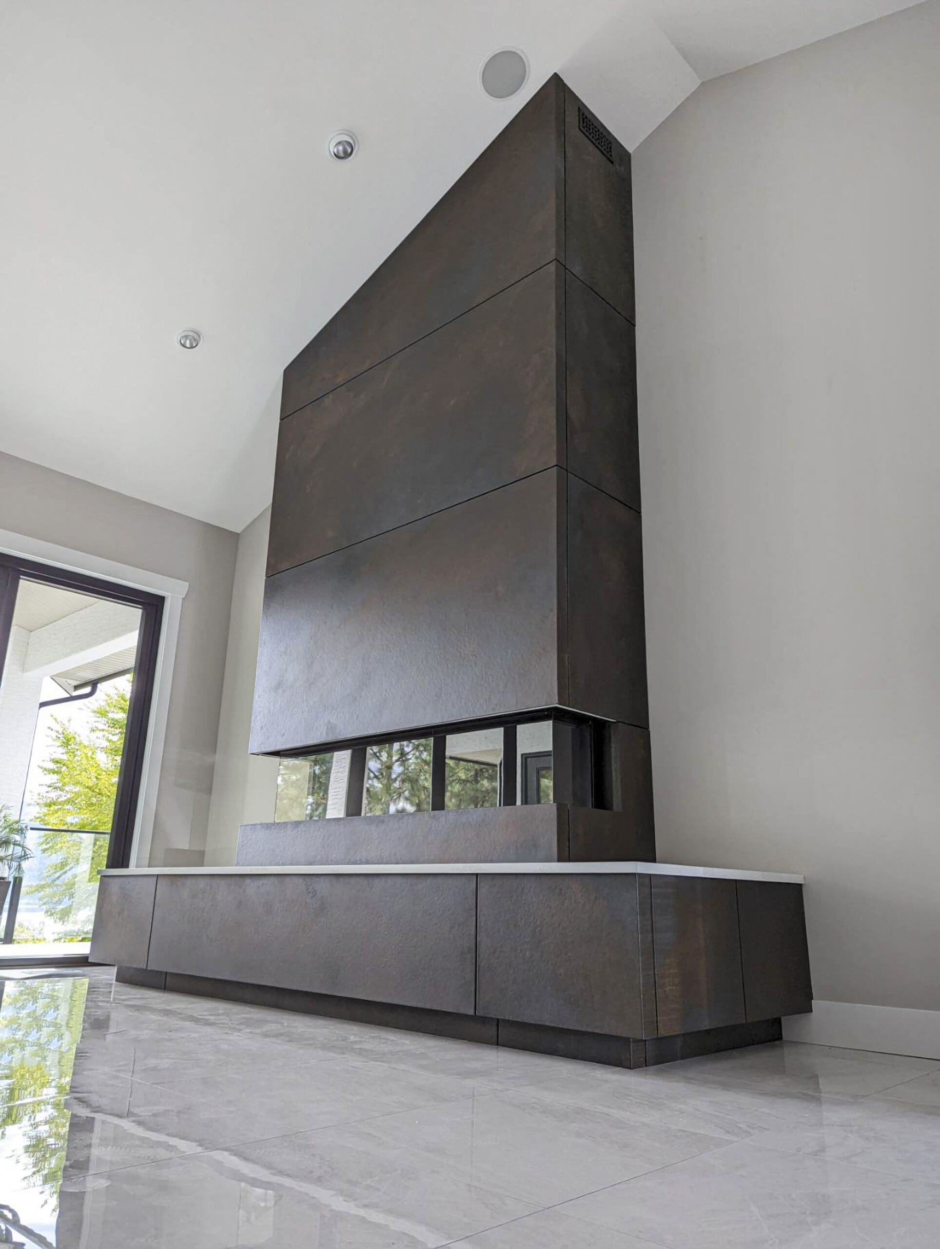 concrete iron oxide panels on fireplace to vaulted ceiling